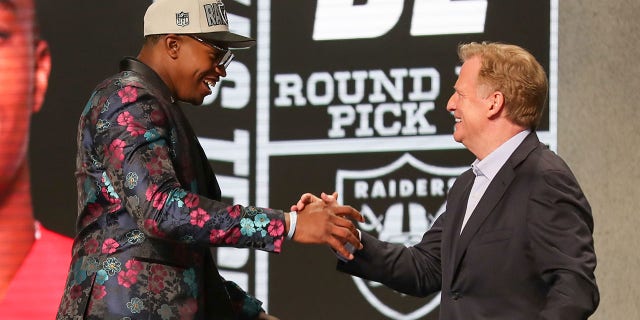 Tyree Wilson shakes hands with Roger Goodell