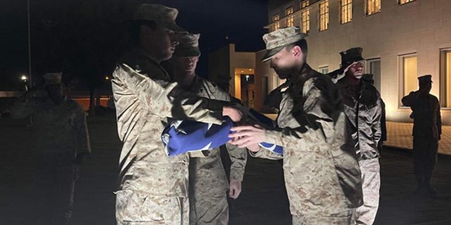 US Marines fold flag at US Embassy in Khartoum, Sudan