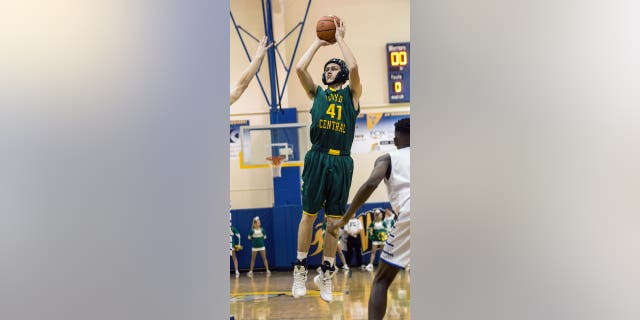 Floyd Central player Connor Sturgeon launches a shot against Christian Academy Indiana, in Louisville, Kentucky, Nov. 24, 2015.