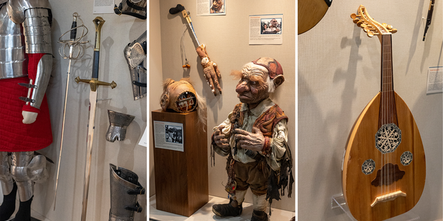 Suit of armor, swords, Hoggle mask and a historic string instrument on display at Unclaimed Baggage Museum.