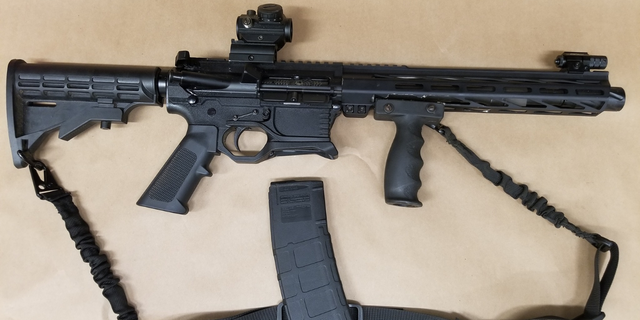 Police then found an AR-15 rifle in his vehicle with a round in the chamber and a loaded magazine, the court document states.