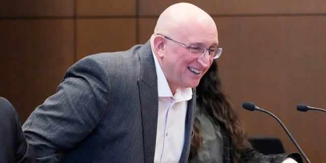 Robert E. Crimo Jr., smiles as he stands after an appearance before Judge George D. Strickland at the Lake County Courthouse, Tuesday, April 4, 2023, in Waukegan, Ill. 