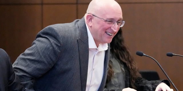 Robert E. Crimo Jr., smiles as he stands after an appearance before Judge George D. Strickland at the Lake County Courthouse, Tuesday, April 4, 2023, in Waukegan, Ill.