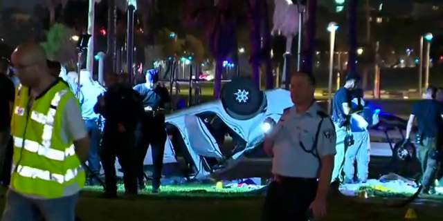 Israeli authorities say that an attack in Tel Aviv has left multiple people injured and one person dead after a car rammed into a group of people.