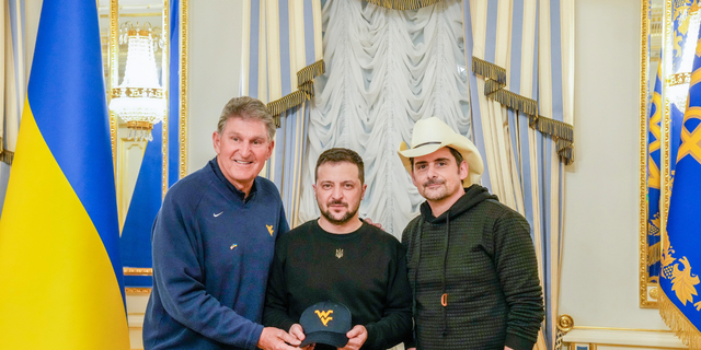 U.S. Sen. Joe Manchin, D-W.V., left, who led a bipartisan delegation to Ukraine on Wednesday, stands with Ukrainian President Volodymyr Zelenskyy, center, and American country music star Brad Paisley, who served as an UNITED24 ambassador.