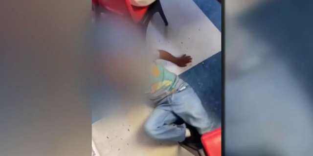 One of the videos appears to show the individual kicking a child's chair, forcing the child to fall on the ground.