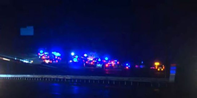 Authorities say a woman is dead and a man is hospitalized after a shootout with police on Interstate 95 in Virginia.