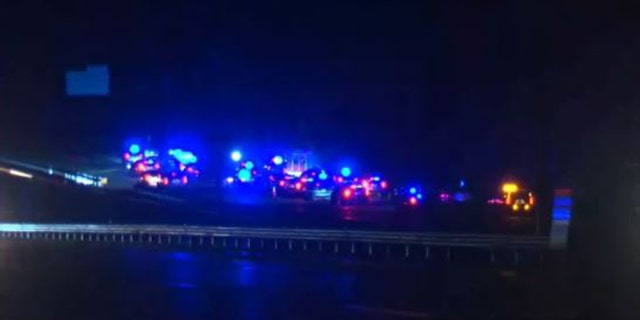 Authorities say a woman is dead and a man is hospitalized after a shootout with police on Interstate 95 in Virginia.