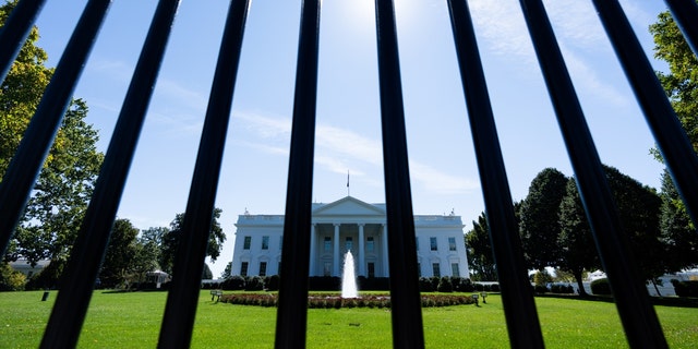 The north front of the White House is seen through the security fence in Washington, D.C., on Oct. 6, 2022.