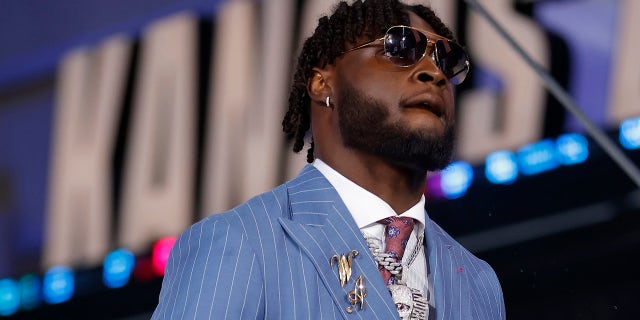 Will Anderson Jr. walks on stage