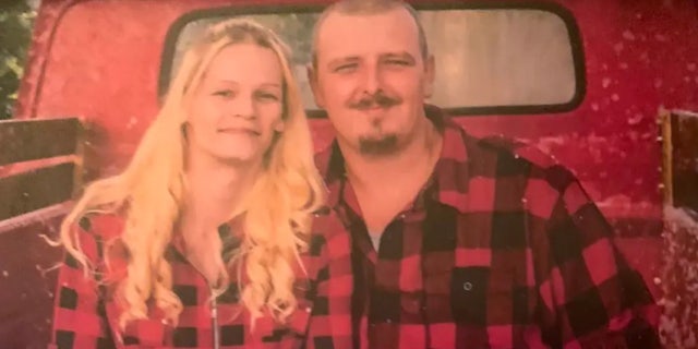 Ashley Hilderbrand and Jamie White in a pick-up truck.