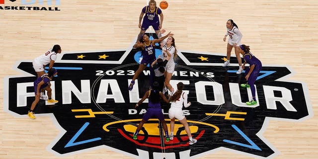 Angel Reese, #10 of the LSU Lady Tigers, tips off against Elizabeth Kitley, #33 of the Virginia Tech Hokies, during the first half during the 2023 NCAA Women's Basketball Tournament Final Four semifinal game at American Airlines Center on March 31, 2023, in Dallas, Texas.