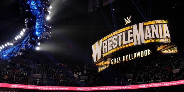 A WrestleMania sign hangs over the crowd during the WWE Monday Night RAW event, Monday, March 6, 2023, in Boston.