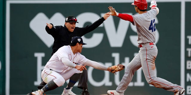 Los Angeles Angels designated hitter Shohei Ohtani gestures safe after advancing to second against the Red Sox at Fenway Park, Saturday, April 15, 2023, in Boston.