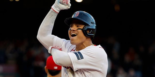 Yu Chang celebrates after his two-run single put the Red Sox ahead to stay against the Los Angeles Angels at Fenway Park on April 15, 2023, in Boston.