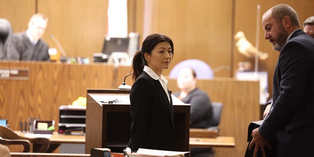 Yue Yu exits the courtroom in the Superior Court of California of the County of Orange Tuesday