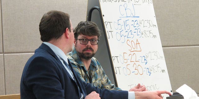 Mitchell Thomas Watley, right, listens to his attorney Nick Polasky before a scheduled court hearing on April 11, 2023, in Juneau, Alaska. A hearing that was scheduled for Tuesday for Watley was pushed to April 21. 