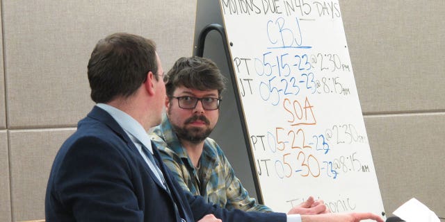 Mitchell Thomas Watley, right, listens to his attorney Nick Polasky before a scheduled court hearing on April 11, 2023, in Juneau, Alaska. A hearing that was scheduled for Tuesday for Watley was pushed to April 21.