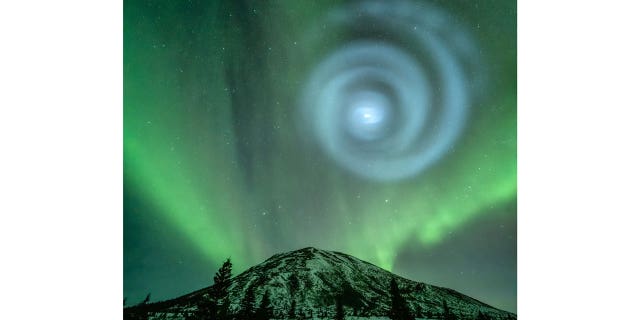 Northern light enthusiasts got a surprise early April 15, 2023, when something odd was mixed in with the green bands of light dancing above the Donnelly Dome near Delta Junction, Alaska.