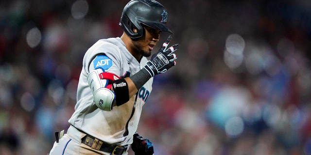 Miami Marlins' Luis Arraez runs to first for a single with one run batted in off of Phillies' Andrew Bellatti, Tuesday, April 11, 2023, in Philadelphia.