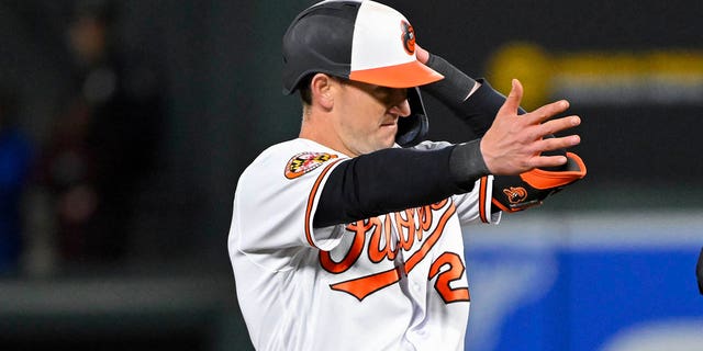 Baltimore Orioles' Austin Hays, left, gestures after hitting a double against Oakland Athletics relief pitcher Domingo Acevedo (not shown) during the eighth inning of a baseball game, Monday, April 10, 2023, in Baltimore. 