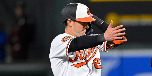 Baltimore Orioles' Austin Hays, left, gestures after hitting a double against Oakland Athletics relief pitcher Domingo Acevedo (not shown) during the eighth inning of a baseball game, Monday, April 10, 2023, in Baltimore.