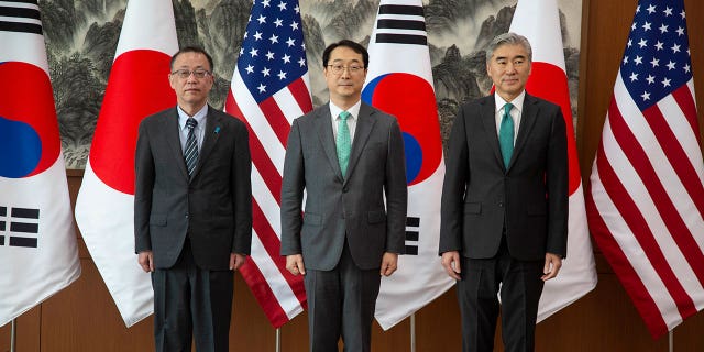 From left to right, Japanese nuclear envoy Takehiro Funakoshi, chief South Korean nuclear negotiator Kim Gunn, and the U.S. special representative to North Korea Sung Kim pose together before their three-way meeting in Seoul, South Korea, on April 7, 2023.