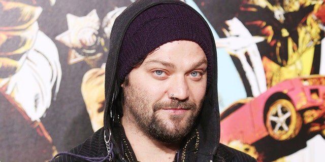 Bam Margera poses in front of art installation
