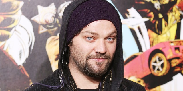 Bam Margera poses in front of art installation