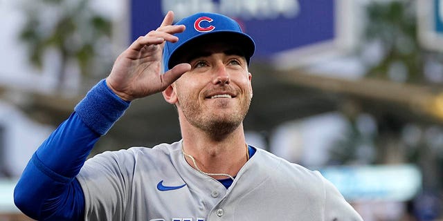 Chicago Cubs center fielder and former Los Angeles Dodger Cody Bellinger gestures to the crowd after being recognized by the Dodgers before a game on Friday, April 14, 2023, in Los Angeles. 
