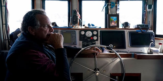 Bob Maharry sits inside his fishing boat in San Francisco, on March 20, 2023. A federal regulatory group has voted to officially close king salmon fishing season along much of the West Coast.
