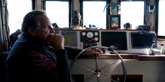 Bob Maharry sits inside his fishing boat in San Francisco, on March 20, 2023. A federal regulatory group has voted to officially close king salmon fishing season along much of the West Coast.
