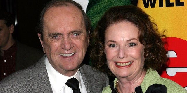 Bob Newhart and Ginnie Newhart smile on red carpet at Elf premiere