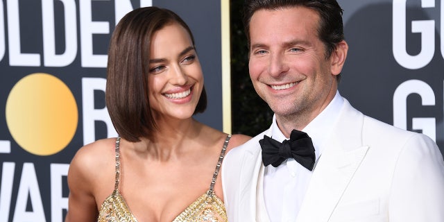 Bradley Cooper wears a white tuxedo at the Golden Globes with Irina Shayk