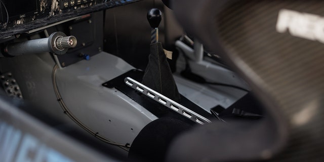 The racing car has a mechanical drift brake actuated by a metal trellis-style handle.