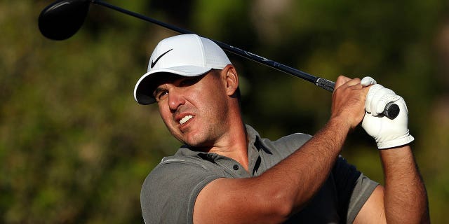 Brooks Koepka plays his shot from the 15th tee during the final round of the Masters Tournament at Augusta National Golf Club on April 9, 2023.