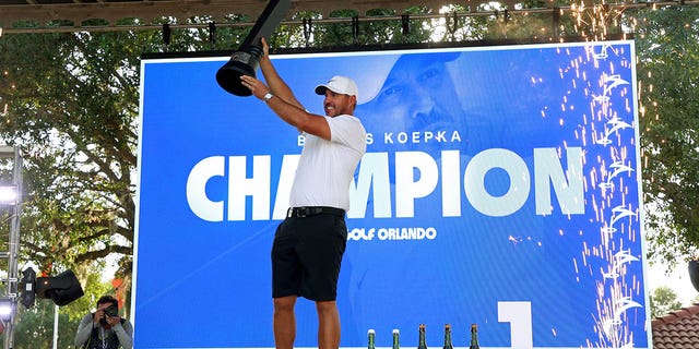 Captain Brooks Koepka of Smash GC celebrates with the trophy after winning the LIV Golf Invitational - Orlando on April 2, 2023, in Florida. 