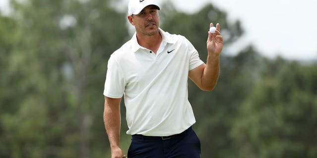 Brooks Koepka of the United States reacts on the 18th green during the second round of the 2023 Masters Tournament at Augusta National Golf Club on April 7, 2023, in Augusta, Georgia.