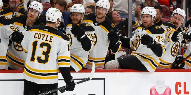 Charlie Coyle greets his teammates