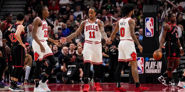 DeMar DeRozan (11) of the Chicago Bulls celebrates with teammates Ayo Dosunmu (12) and Kobe White (0) of the Toronto Raptors during the 2023 playoffs at Scotiabank Arena on April 12, 2023 in Toronto.