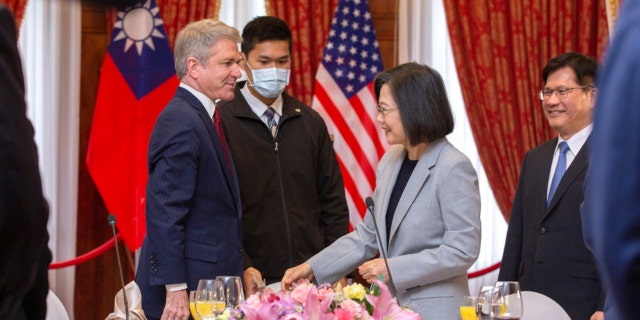 In this photo released by the Taiwan Presidential Office, House Foreign Affairs Committee Chairman Michael McCaul, R-Texas, left, and Taiwan's President Tsai Ing-wen, speak at a luncheon during a visit by a Congressional delegation to Taiwan in Taipei, Taiwan, Saturday, April 8, 2023.