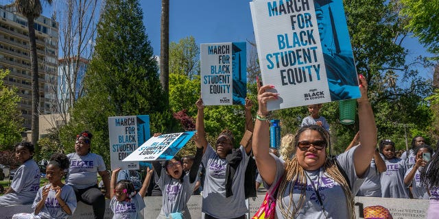 Vanessa Oden, vice principal of elementary at Elite Public Schools in Vallejo, attends a Black in School Coalition rally in Sacramento, California, on April 11, 2023. The rally was held to oppose an education budget proposal for not going far enough to close the academic achievement gap for Black students.