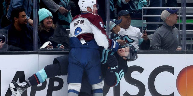 Cale Makar hitting Jared McCann