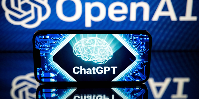 Screens display the logos of OpenAI and ChatGPT on Jan. 23, 2023.