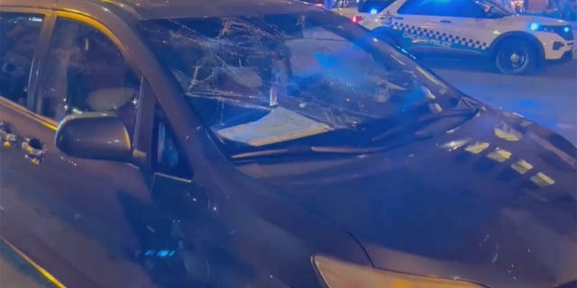 Teens smashed car windows during the chaos in downtown Chicago on Saturday.