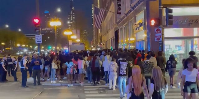 Teens flooded downtown Chicago on Saturday night, smashing car windows and attacking tourists.
