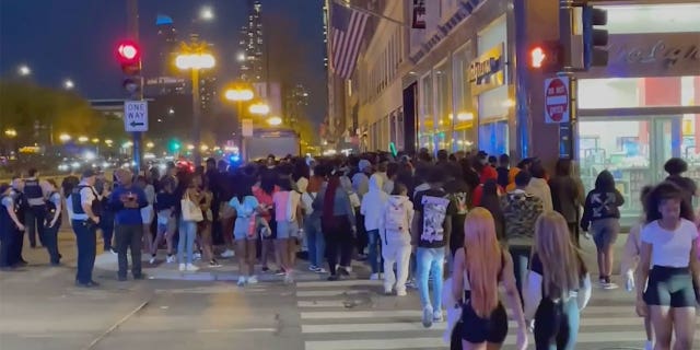 Teens flooded downtown Chicago on Saturday night, smashing car windows and attacking tourists.