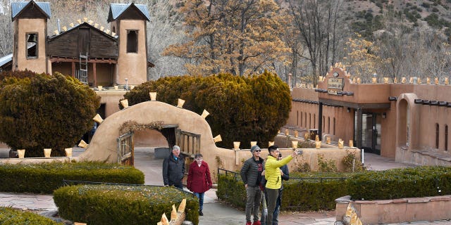 People visit El Santuario de Chimayó near Santa Fe, New Mexico, on Dec. 24, 2019. Thousands of Catholics are making the trek to the historic site, which is one of the most important Catholic pilgrimage centers in the U.S.
