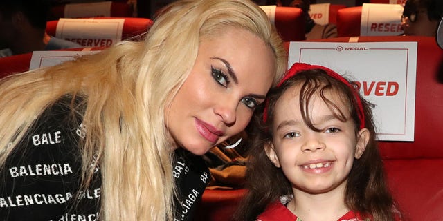 Coco Austin smiling with her daughter