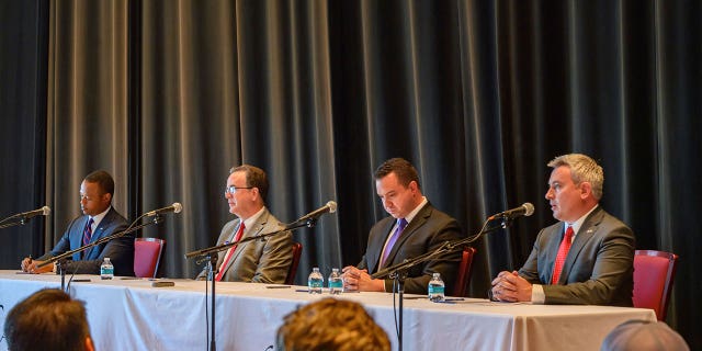 Republican gubernatorial candidate Daniel Cameron, left, participate in a forum on April 18, 2023, in Kentucky.
